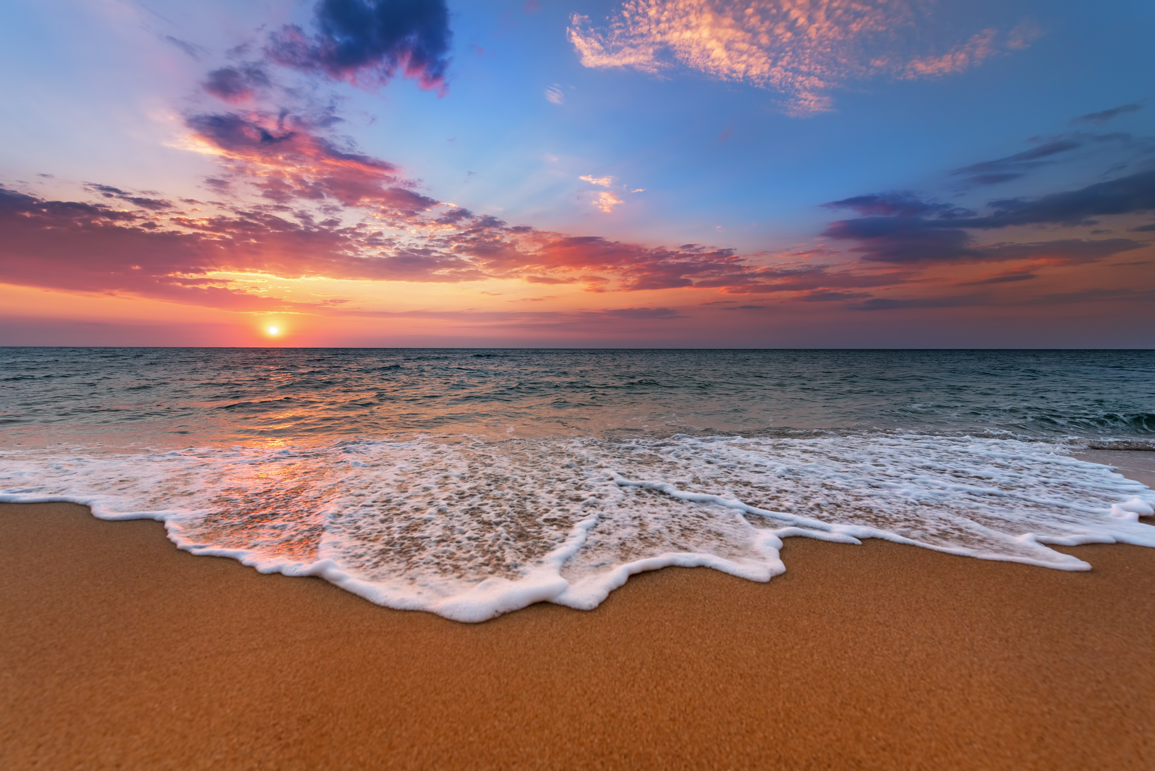 Colorful ocean beach sunrise.